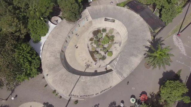 Stunning flyover aerial shot of Botanical Garden; Medellin, Colombia, Parque Explora, Jardin Botanico