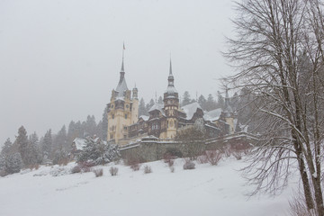 Fototapeta na wymiar Peles Castle in Romania Predeal, blizzard in Brasov Sinaia