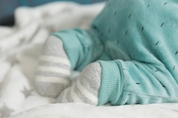 Fototapeta na wymiar A newborn baby lies on a blanket, studio photo.