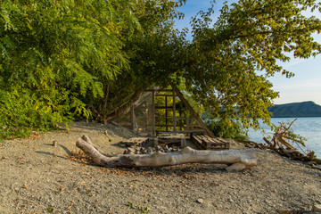 highland European green forest and wooden bungalow frame pattern building on lake waterfront summer colorful scenery landscape view 