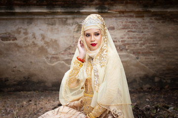 Fototapeta premium Portrait Of Young Bride Wearing wedding Hijab Standing and Looking Away