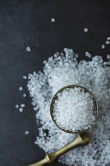 Large sea salt. Spice. Mortar and pestle for grinding.