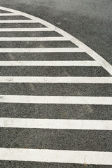 Tarmac texture stripped lines on asphalt surface