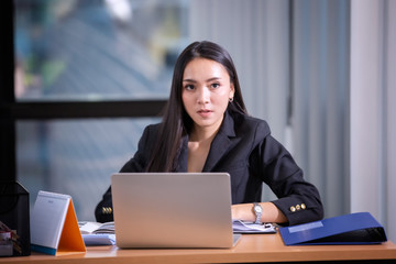 Portrait of young businesswoman in office