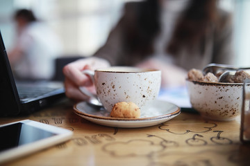 Girl eating coffee cakes