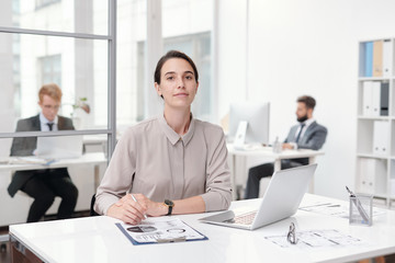 Young Businesswoman Sitting at Desk