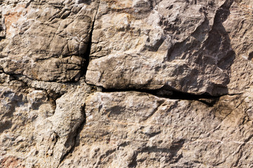 Cracked and weathered natural stone background