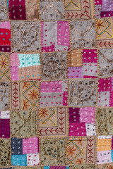 Detail patchwork carpet in India. Close up