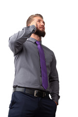 Fototapeta premium Attractive business man is talking on his smart phone