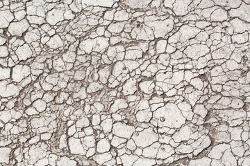 Cracked and weathered Tarmac texture on road background
