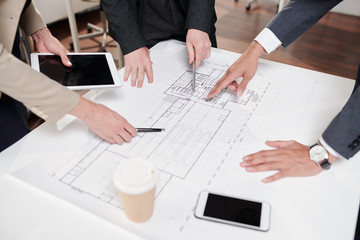 Team of Business People Discussing Construction Plans