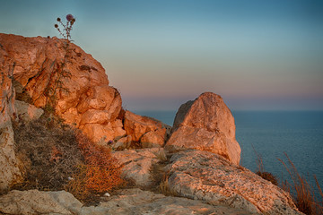 Summer natural landscape. Sea cliffs and beautiful sunset.