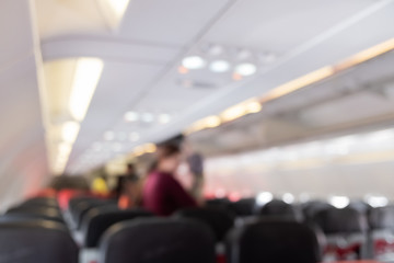 Blur inside airplane economy class and traveller travel.
