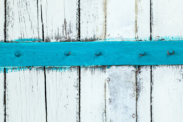 Rough painted white paint wooden background. Surface damaged by time