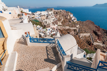 Beautiful blue sea and white buildings at Santorini island.