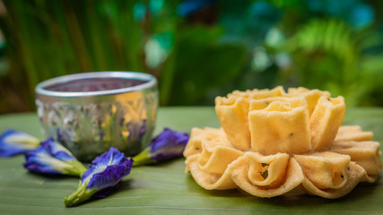 Thai homemade crispy Lotus blossom cookie delicious snack. Thai traditional snack.