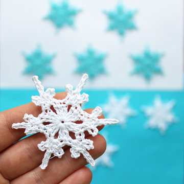 Crochet decorations, snowflakes for new year and Christmas of different colors.