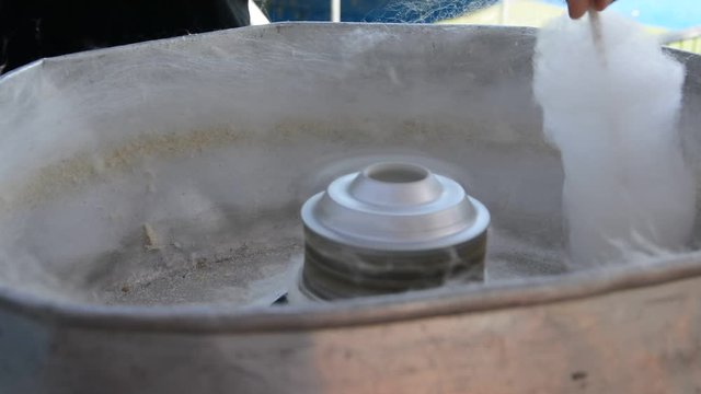 candy floss machine at work. Machine making cotton candy at the festival.