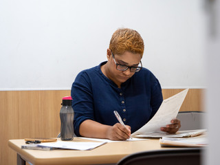 Fashionable Indian lady working at her desk