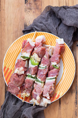 raw meat with herbs and garlic for grill on dish