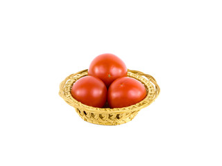Tomatoes in a basket on a white background