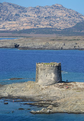 aerial view of the ancient watchtower La Pelosa, located in an islet beetween the Asinara island and Capo Falcone in northern Sardinia, near Stintino