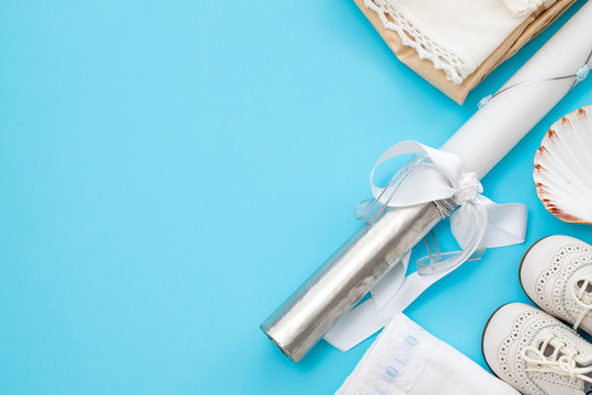 flat lay catholic baptism on blue background