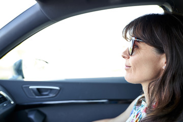 Fototapeta na wymiar woman sitting in the passenger seat of a car