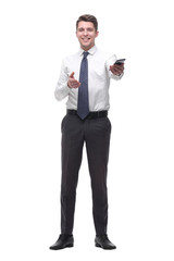 friendly young businessman with smartphone. isolated on white