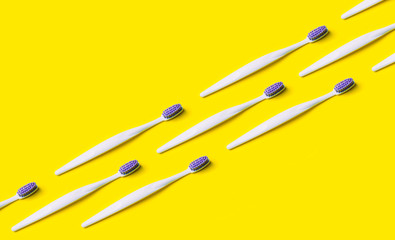 Toothbrush minimal pattern on yellow background.