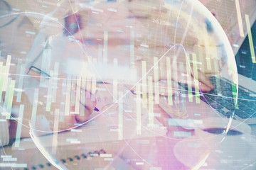 Multi exposure of businessman working on laptop on background. International business hologram in front. Concept of success.