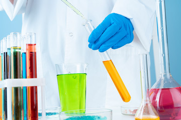 Scientific experiments in a chemistry lab.  Color liquids and test tube
