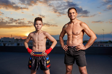 Fighter and coach posing