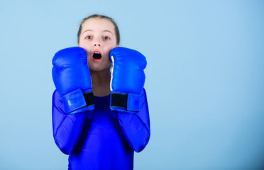 With great power comes great responsibility. Boxer child in boxing gloves. Female boxer change...