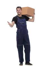 work in overalls with a cardboard box on his shoulder. isolated on white