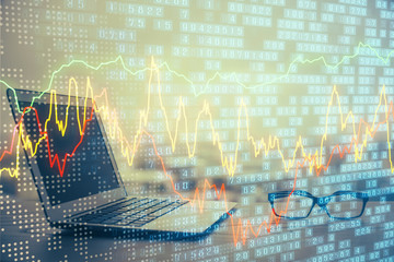 Forex market graph hologram and personal computer on background. Double exposure. Concept of investment.