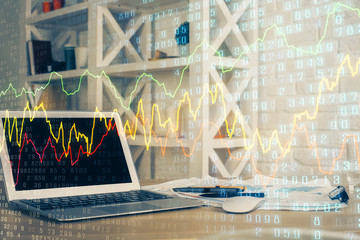 Double exposure of chart and financial info and work space with computer background. Concept of...