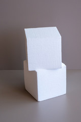 White foam cubes on a gray background. The classic version of studio lighting.