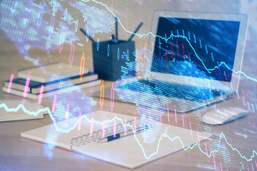 Financial market graph hologram and personal computer on background. Multi exposure. Concept of forex.