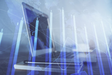 Stock market graph and table with computer background. Double exposure. Concept of financial analysis.