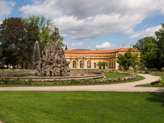 Fototapeta na wymiar baroque palace garden with fountain and orangery in Erlangen Bavaria, Germany