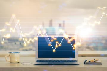 Stock market graph and table with computer background. Double exposure. Concept of financial analysis.