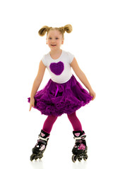 Little girl on roller skates.