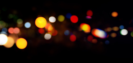  Red and fire orange bokeh lights on black background. Bokeh abstract background. Orange Christmas background, Halloween bokeh background