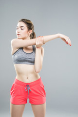 Fototapeta na wymiar Beautiful fitness woman, Fitness girl do sport exercises isolated over gray background
