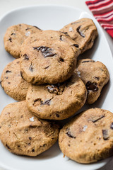 Paleo Chocolate Chip Cookies Made with Coconut and Almond Flour on Baking Sheet / Paper.