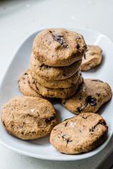 Paleo Chocolate Chip Cookies Made with Coconut and Almond Flour on Baking Sheet / Paper.