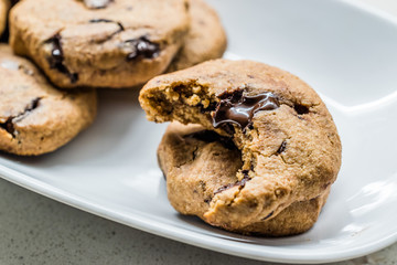 Paleo Chocolate Chip Cookies Made with Coconut and Almond Flour on Baking Sheet / Paper.