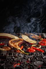 Eggplant vegetables, tomatoes, onions and peppers are grilled.