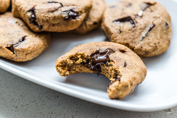 Paleo Chocolate Chip Cookies Made with Coconut and Almond Flour on Baking Sheet / Paper.